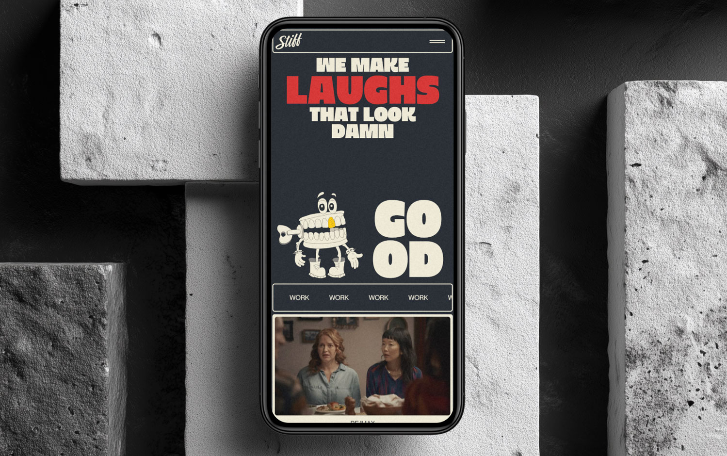 Phone screen with playful text and cartoon teeth against a textured stone background.